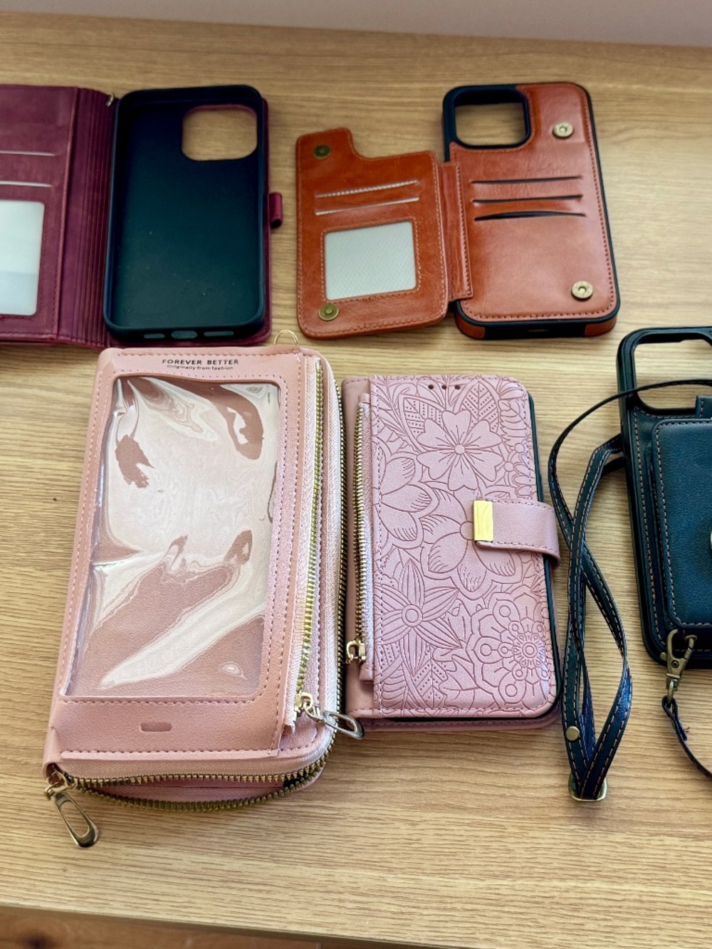 FIVE IPHONE MAX PRO CASES/WALLETS